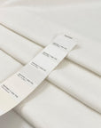 Heavy white cotton with slight stretch, very soft and warm to the touch, ideal for hoodies, jackets, trousers, and structured garments. High-quality deadstock collected in Stock from a Maison de Couture in Italy.