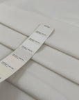 Cotton gabardine with nylon and elastane. Stretch, soft, and heavy in white. High-quality deadstock fabric collected in Stock from a Maison de Couture in Italy.