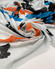 Printed polyester voile worked with soft transparent fluid crepe