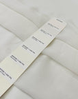 Pure silk georgette in white, color reference Star White. Very soft, light, transparent, and flowy—ideal for dresses, skirts, blouses, and shirting. High-quality deadstock collected in Stock from a Maison de Couture in Italy.