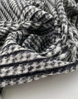 Prince of Wales, stretched wool boiled jersey. Geometric pattern and structured. High quality deadstock fabric.