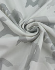White pure cotton French terry with camouflage print, soft and non-stretch. High-quality deadstock collected in Stock from a Maison de Couture in Italy.