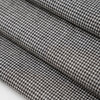Square pattern in black and white wool and nylon fabric. It is stretch and falling. High-quality deadstock fabric collected in Stock from a Maison de Couture in Italy. Square pattern in black and white wool and nylon fabric. It is stretch and falling. High-quality deadstock fabric collected in Stock from a Maison de Couture in Italy.