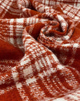 Soft checkered mixed wool tweed in orange and white. High quality deadstock fabric.