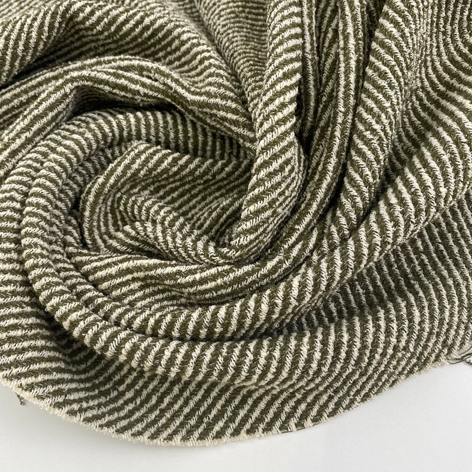 Tweed in a viscose and cotton blend with a soft hand and elegant texture. Ideal for jackets, skirts, and light coats. High-quality deadstock collected in Stock from a Maison de Couture in Italy.