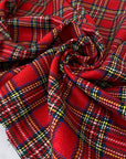 Tartan fabric in a soft wool and polyester blend with a classic Scottish design in shades of red, blue, white, and green. Very soft and warm, ideal for dresses, skirts, and light jackets. High-quality deadstock collected in Stock from a Maison de Couture in Italy.