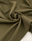 Pure green wool gabardine, structured and heavy. High-quality deadstock fabric collected in Stock from a Maison de Couture in Italy.