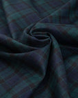 Dark and falling pure watch wool tartan. High-quality deadstock fabric collected in Stock from a Maison de Couture in Italy.