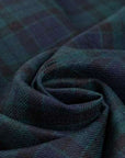Dark and falling pure watch wool tartan. High-quality deadstock fabric collected in Stock from a Maison de Couture in Italy.