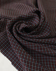 Pure viscose with a check pattern in the shades of black, red, and white. Very soft, flowy, and not transparent. Ideal for skirts and dresses. High-quality deadstock collected in Stock from a Maison de Couture in Italy.