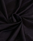 Cool black stretch and falling jersey fabric. Deadstock fabric picked up in Stock from a Maison de Couture in Italy.