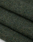 Green pure soft and spongy wool fabric. High quality deadstock fabric.