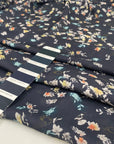 Pure silk with a subtle sheen and small floral design, dark blue base, slightly transparent. Ideal for blouses, dresses, and delicate layers. High-quality deadstock collected in Stock from a Maison de Couture in Italy.