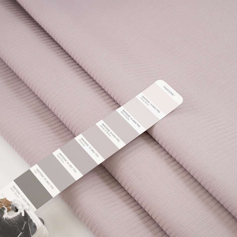 Soft cotton jacquard fabric in pale purple. High quality deadstock fabric.