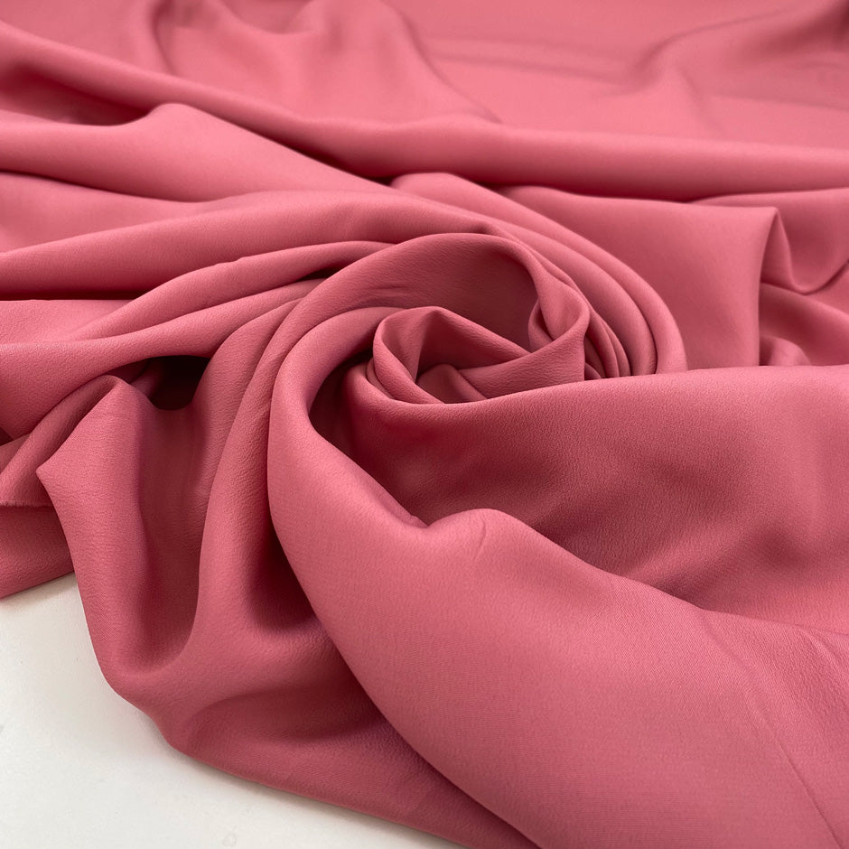 Silk and acetate crepe de chine in dark pink, very light and soft. High-quality deadstock fabric by the meter collected in Stock from a Maison de Couture in Italy.