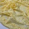 Polyester lace in limelight yellow with double scallop. Light and decorative, ideal for dresses, blouses, and skirts. High-quality deadstock collected in Stock from a Maison de Couture in Italy.