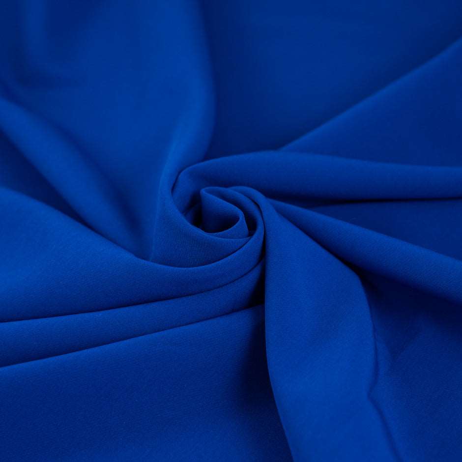 Electric blue with droopy and stretchy polyester technical fabric. High quality deadstock fabric.