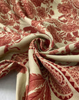 Mixed cotton and linen gabardine with floral design camel base and dark red winery pattern slightly stiff ideal for jackets skirts and trousers. High-quality deadstock collected in Stock from a Maison de Couture in Italy.