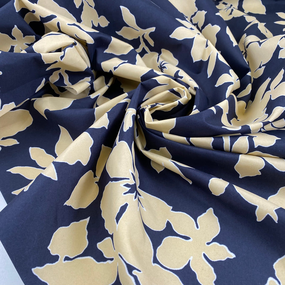 Printed polyester cinzato with floral design in dark blue, ecru, and yellow, very crunchy and not transparent, ideal for structured garments and bold pieces. High-quality deadstock collected in Stock from a Maison de Couture in Italy.
