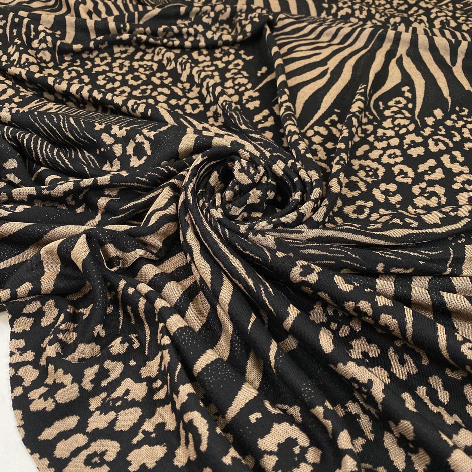 Viscose and polyester jersey, very soft, light and stretchy. With animalier design in black and beige shades. High-quality deadstock fabric collected in Stock from a Maison de Couture in Italy.