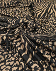 Viscose and polyester jersey, very soft, light and stretchy. With animalier design in black and beige shades. High-quality deadstock fabric collected in Stock from a Maison de Couture in Italy.