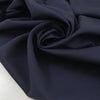 Pure virgin wool in dark blue with a subtle textured micro square design. Very soft, light, and not transparent. Ideal for shirting, dresses, and lightweight garments. High-quality deadstock collected in Stock from a Maison de Couture in Italy.