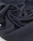 Blend of virgin wool, polyamide and linen in dark blue and black.&nbsp;High quality deadstock fabric.