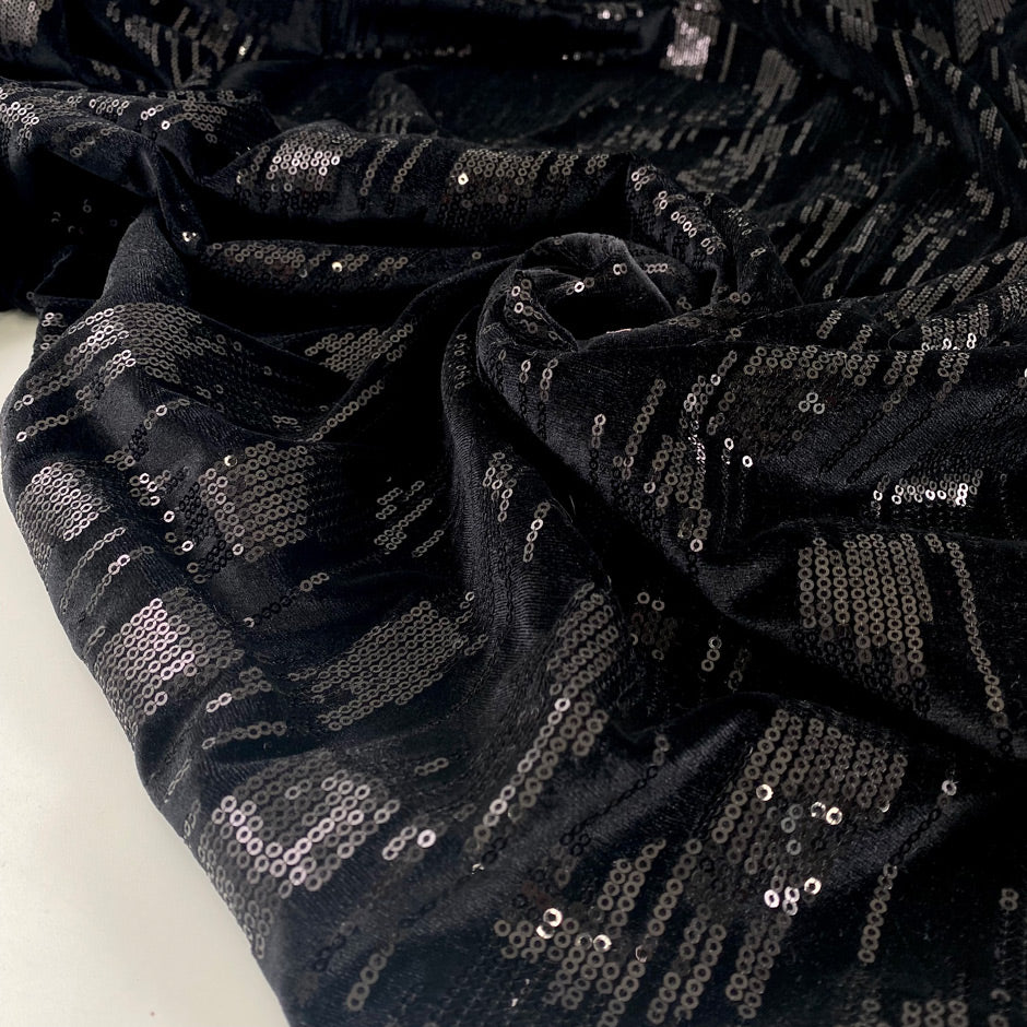 Stretch polyester chenille with shiny paillettes and geometric design soft light and fluid ideal for bold eveningwear. High-quality deadstock collected in Stock from a Maison de Couture in Italy.