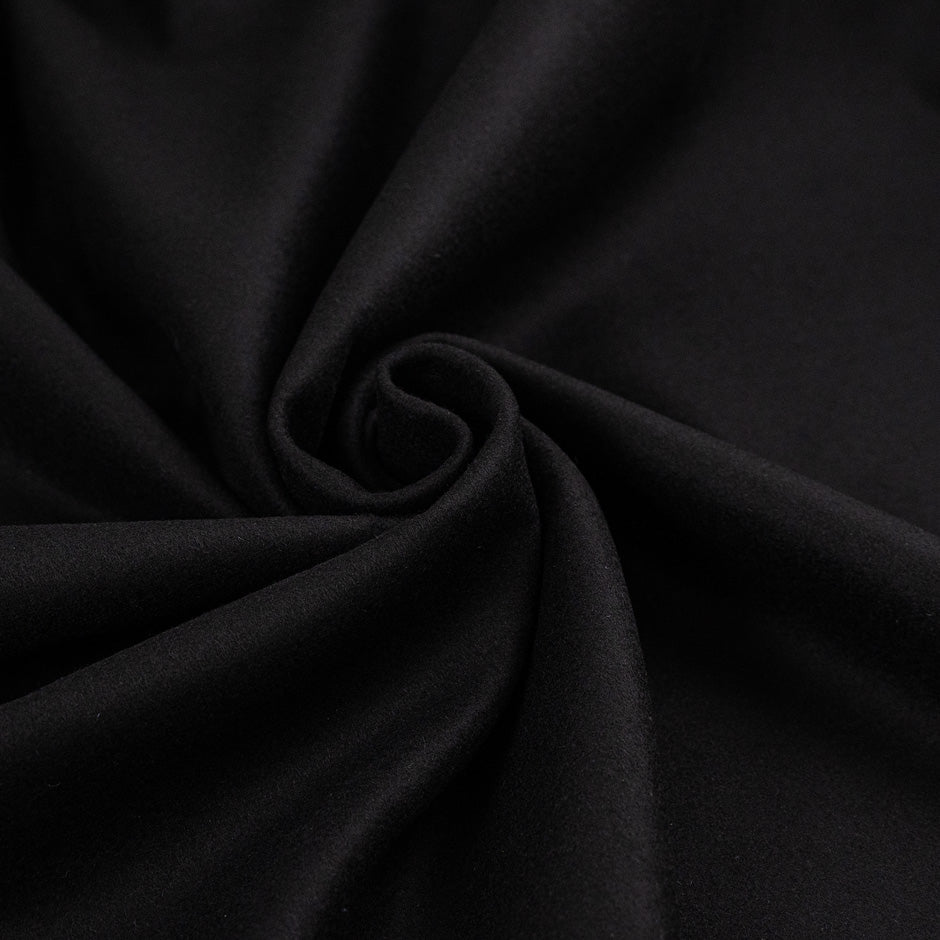 Black soft virgin wool blend coat weight. High quality deadstock fabric.