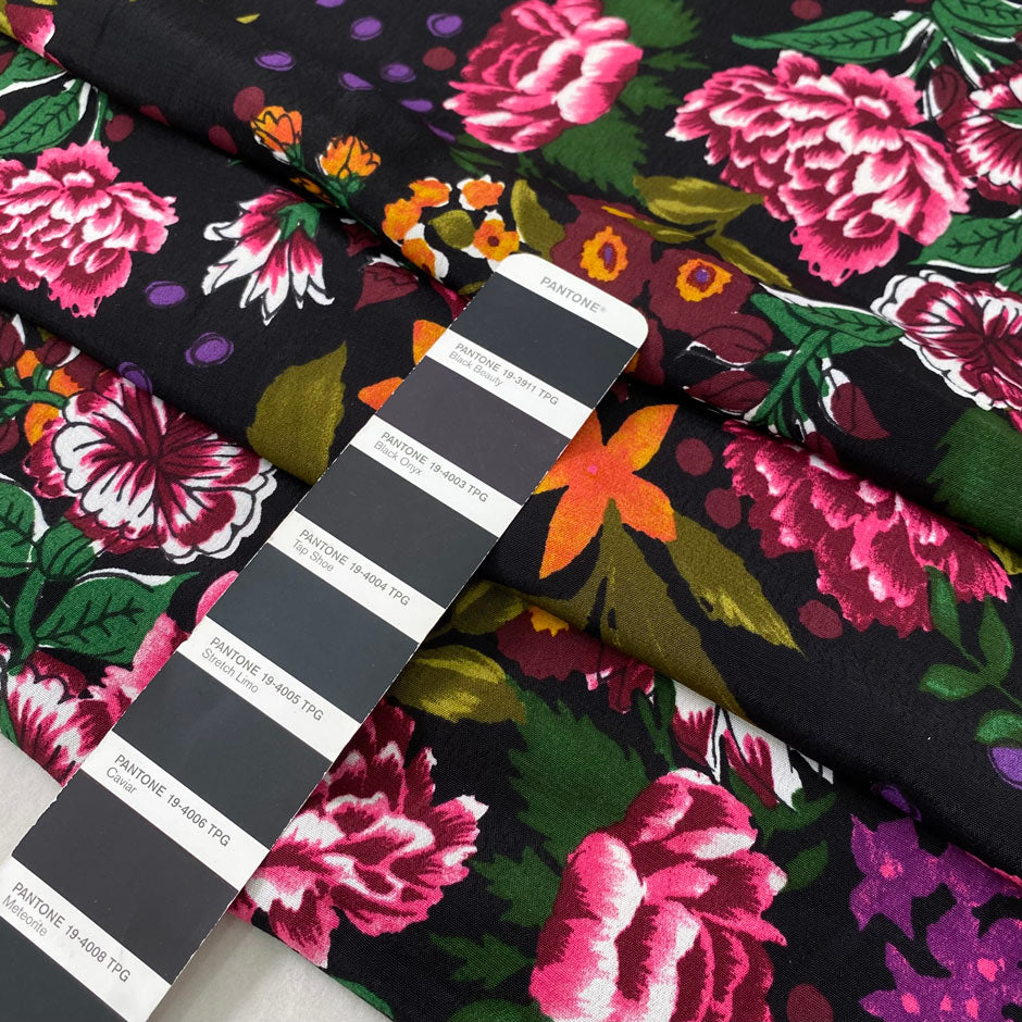 Pure viscose with floral design in panels. The ground is black and the print is in the shades of green, orange, dark red, and fuchsia. Very soft, light, and flowy. Ideal for dresses, skirts, and blouses. High-quality deadstock collected in Stock from a Maison de Couture in Italy.