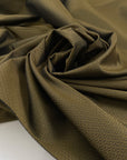 Polyester jacquard in olive green and black. Very soft and light with a very small pattern. High-quality deadstock fabric collected in Stock from a Maison de Couture in Italy.