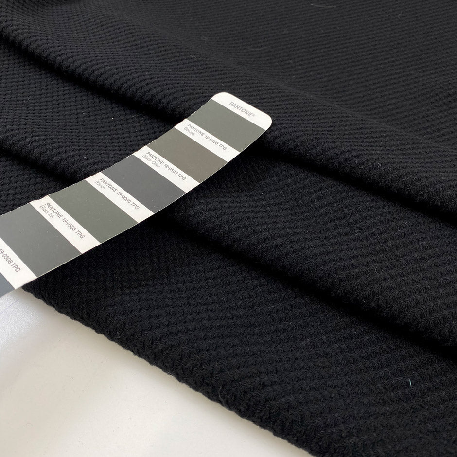 Black mesh fabric in a blend of cotton, polyester, and elastane with a textured surface, soft, breathable, and slightly stretchy. Ideal for inserts, layering, and sporty pieces. High-quality deadstock collected in Stock from a Maison de Couture in Italy.