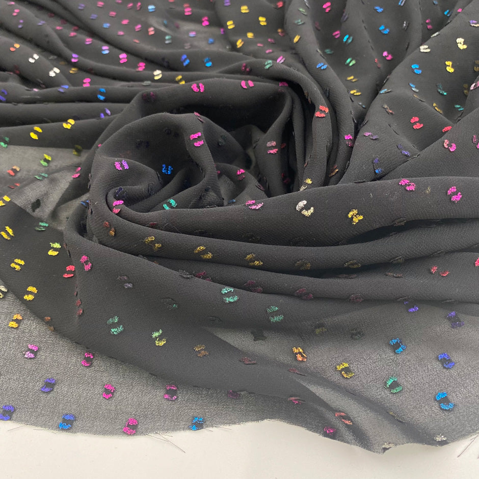Transparent fil coupé in black background polyester. High-quality deadstock fabric by the meter collected in Stock from a Maison de Couture in Italy.