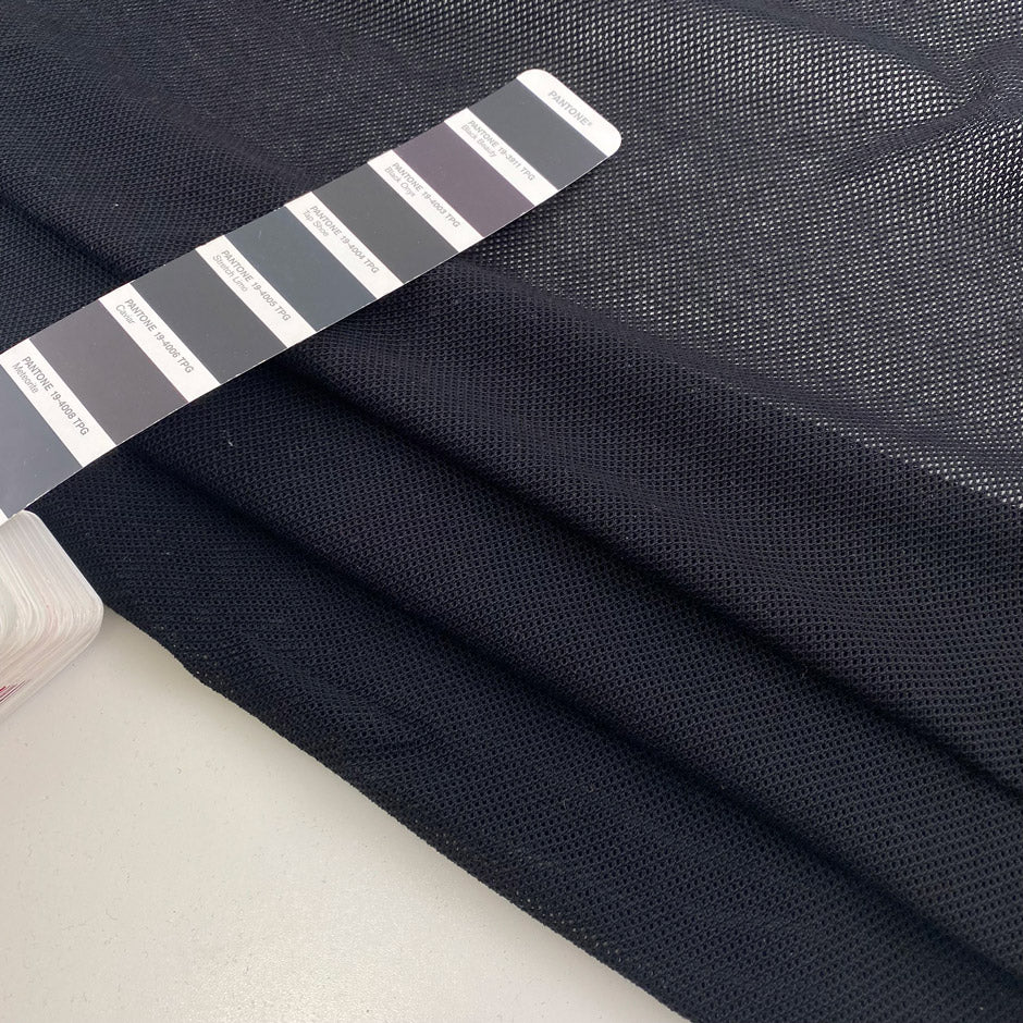 Black pure cotton mesh knit stretch and transparent. High-quality deadstock fabric collected in Stock from a Maison de Couture in Italy.