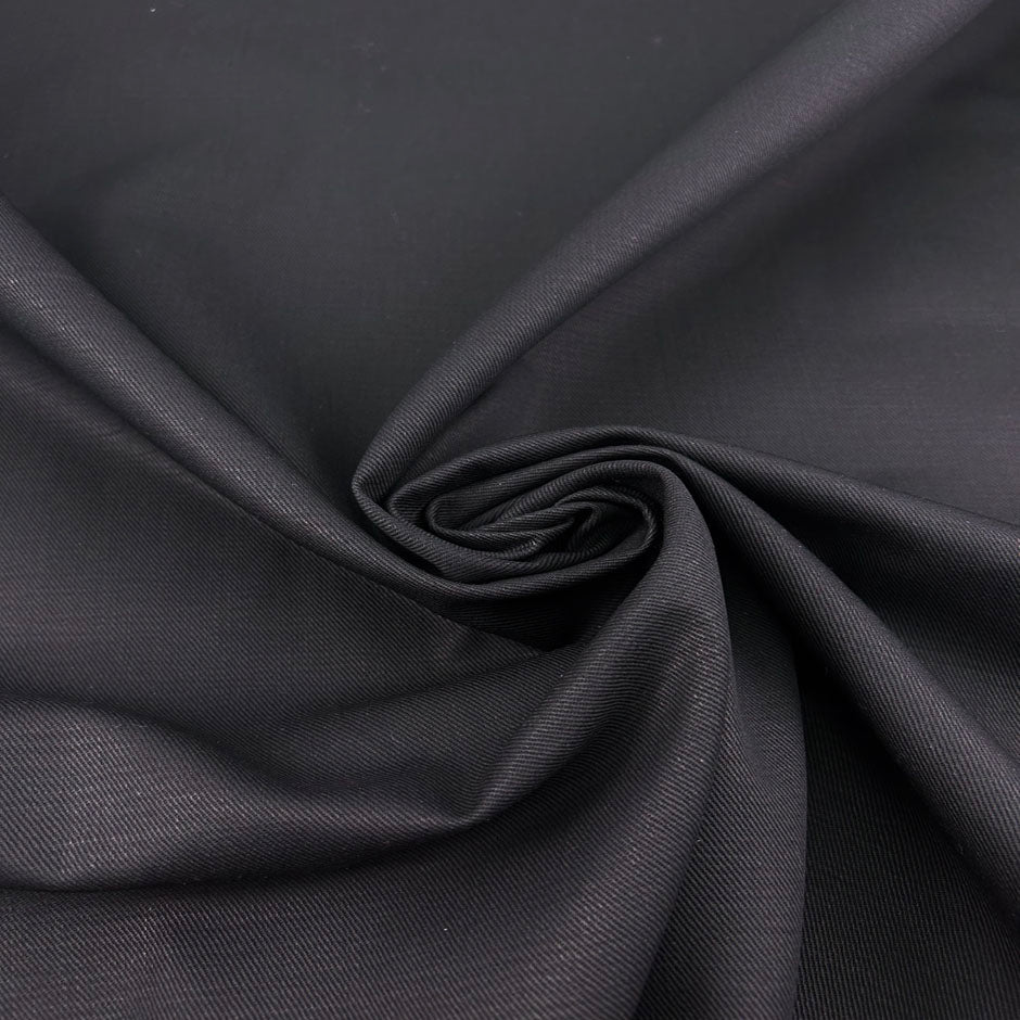 Black structured cotton denim and non-stretch. Perfect for jackets. High-quality deadstock collected in Stock from a Maison de Couture in Italy.