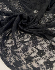 Viscose and polyester stretch light lace in black, flower design. High-quality deadstock fabric collected in Stock from a Maison de Couture in Italy.