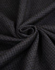 Milan stitch of dark grey cotton and wool. The fabric is droopy and stretchy. High-quality deadstock fabric collected in Stock from a Maison de Couture in Italy.