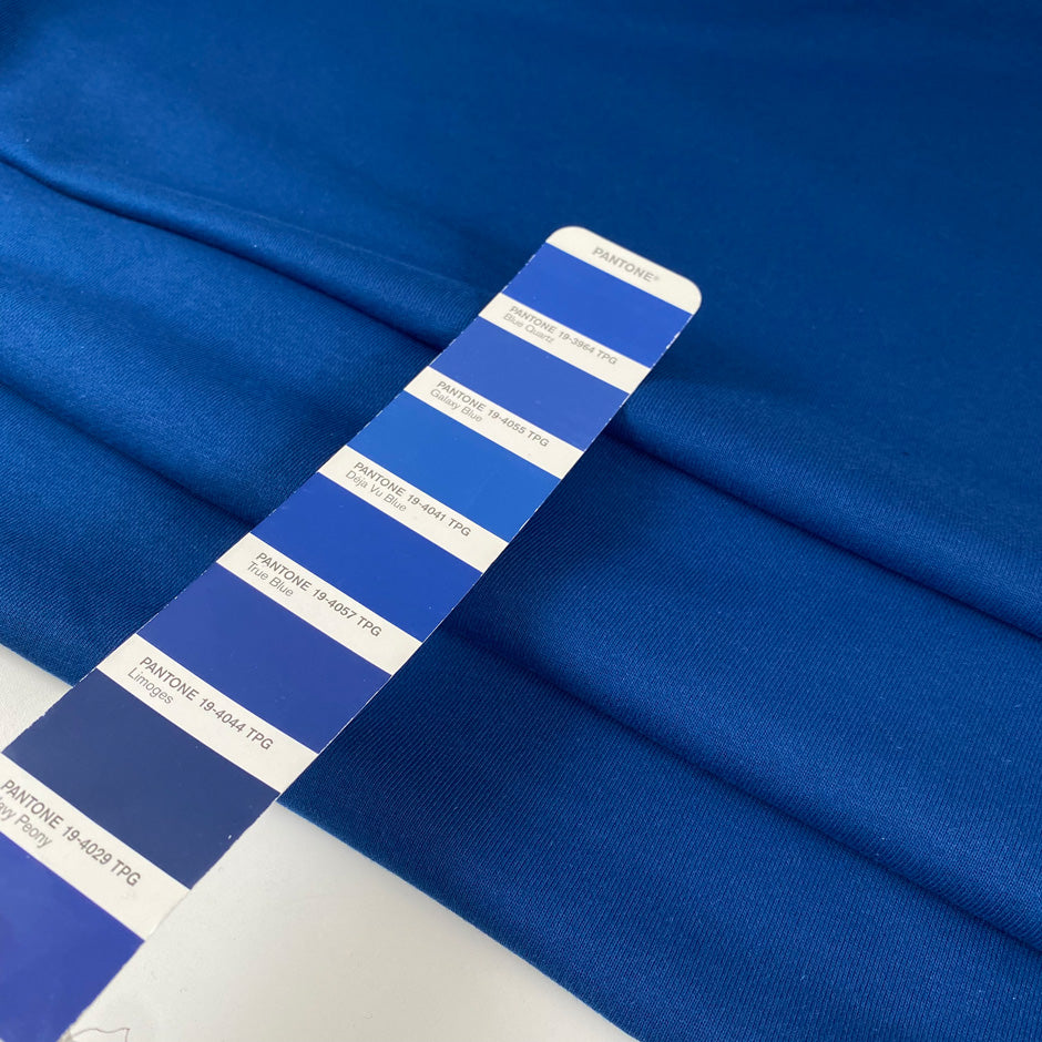 Warm cotton sweatshirt fabric in galaxy blue, very soft and medium weight. Ideal for trousers, sweatshirts, and jackets. High-quality deadstock collected in Stock from a Maison de Couture in Italy.