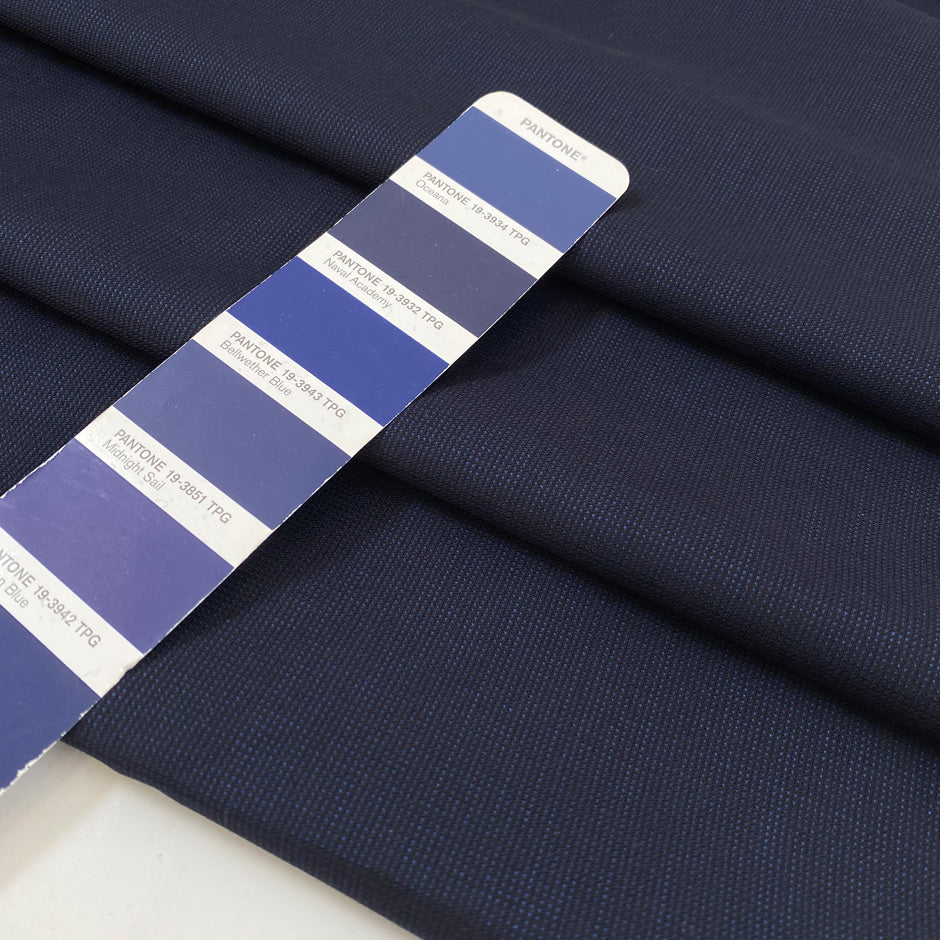 Pure virgin wool in dark blue with a subtle textured micro square design. Very soft, light, and not transparent. Ideal for shirting, dresses, and lightweight garments. High-quality deadstock collected in Stock from a Maison de Couture in Italy.