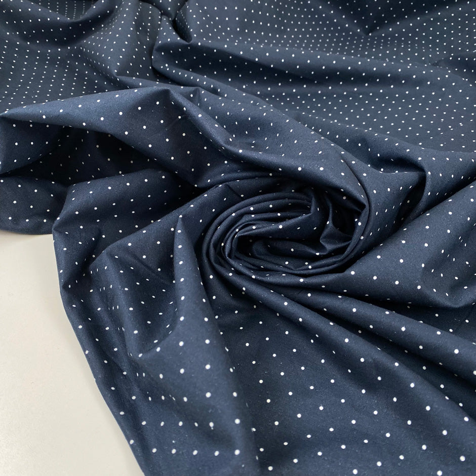 Cotton poplin with polka dot design in dark blue and white, very soft, light, and not transparent, ideal for shirts, dresses, and skirts. High-quality deadstock collected in Stock from a Maison de Couture in Italy.