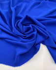 Soft, droopy polyester cady in electric blue. Picked up in Stock from a Maison de Couture in Italy. High quality deadstock fabric.