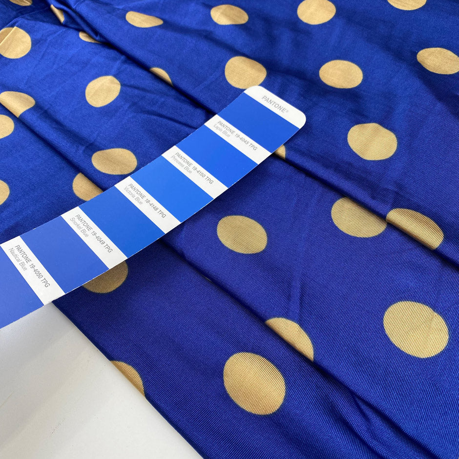 Pure and cold viscose jersey in blue, polka dots design in mustard. Bi-stretch, soft and light. High-quality deadstock fabric collected in Stock from a Maison de Couture in Italy.