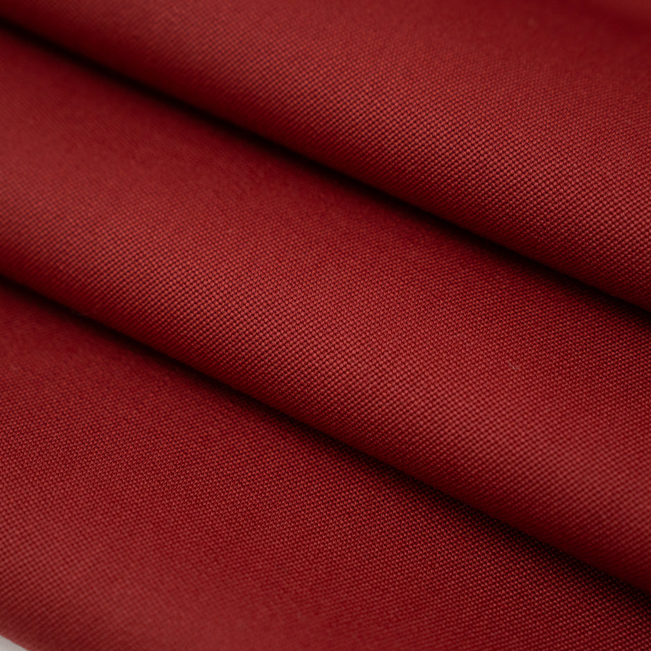 Soft and falling pure red wool gabardine. High-quality deadstock fabric collected in Stock from a Maison de Couture in Italy.