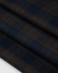 Lightweight blue and brown checked flannel pure virgin wool. High-quality deadstock fabric collected in Stock from a Maison de Couture in Italy.