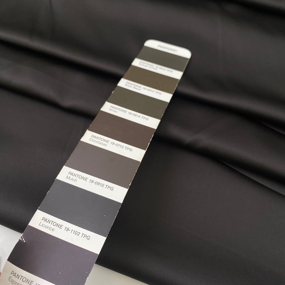 Brown matte polyester satin with a soft touch and elegant drape ideal for dresses skirts and linings. High-quality deadstock collected in Stock from a Maison de Couture in Italy.