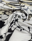 Polyester jersey in abstract design in white, sand, beige, black and gray shades. Very soft, flowy and stretch. High-quality deadstock fabric collected in Stock from a Maison de Couture in Italy.