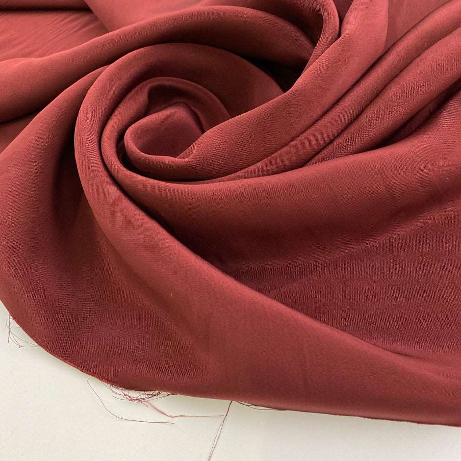 Red fabric of viscose cady and acetate. High quality deadstock.