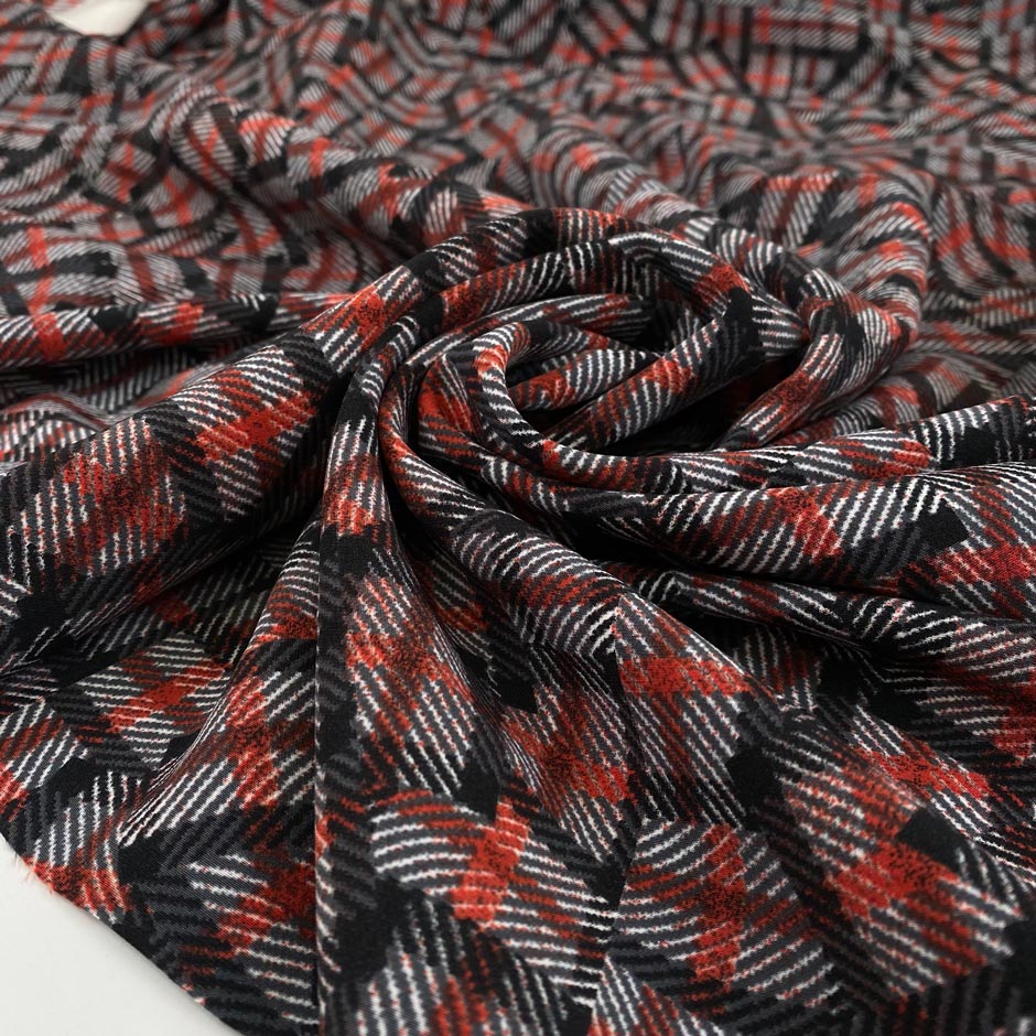 Stretch polyester cady with a geometrical design in white, red, black and gray shades shades. Very soft and flowy, not transparent. High-quality deadstock fabric collected in Stock from a Maison de Couture in Italy.