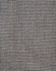 Square pattern in black and white wool and nylon fabric. It is stretch and falling. High-quality deadstock fabric collected in Stock from a Maison de Couture in Italy.