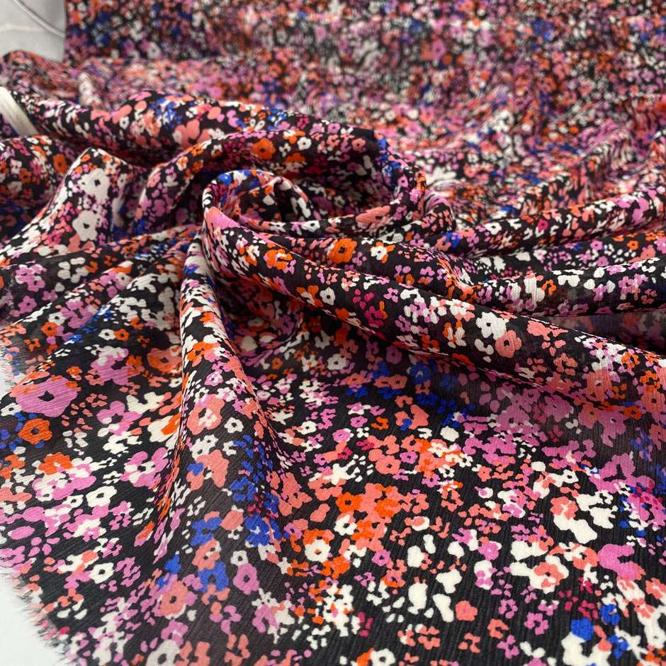 Pure silk chiffon soft and falling. The ground i black and the design is floral and multicolor. High-quality deadstock fabric collected in Stock from a Maison de Couture in Italy.